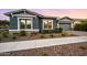 Attractive home featuring neat desert landscaping in the front yard, complemented by a two-car garage at 10322 E Topaz Ave, Mesa, AZ 85212