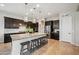 Modern kitchen featuring a large island with seating and stainless steel appliances at 10322 E Topaz Ave, Mesa, AZ 85212