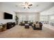 Spacious living room featuring plush seating, natural light, and open layout at 10322 E Topaz Ave, Mesa, AZ 85212