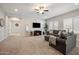 Comfortable living room with large windows, plush seating, and ample natural light at 10322 E Topaz Ave, Mesa, AZ 85212