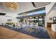 Clubhouse lounge with tables and chairs, stylish lighting, and large windows at 10322 E Topaz Ave, Mesa, AZ 85212