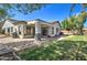This backyard patio features a built-in grill, perfect for entertaining, and plenty of room for outdoor dining and lounging at 10402 E Javelina Ave, Mesa, AZ 85209