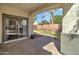 Backyard patio featuring a covered area and view of the landscaped backyard at 10402 E Javelina Ave, Mesa, AZ 85209