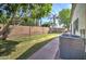 The spacious backyard has well-maintained green grass, ideal for outdoor activities, and convenient air conditioning units at 10402 E Javelina Ave, Mesa, AZ 85209
