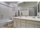 Bathroom features a double vanity and neutral color palette at 10402 E Javelina Ave, Mesa, AZ 85209
