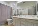 Bathroom features a double vanity and neutral color palette at 10402 E Javelina Ave, Mesa, AZ 85209