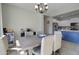 An elegant dining area shows a wet bar and access to a bright kitchen area at 10402 E Javelina Ave, Mesa, AZ 85209