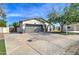 Inviting home with a well-maintained front yard, driveway, and two-car garage at 10402 E Javelina Ave, Mesa, AZ 85209