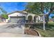 Beautiful home with manicured lawn, two-car garage, and inviting front entrance at 10402 E Javelina Ave, Mesa, AZ 85209