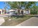 Single-Gathering home with fresh landscaping and a 'For Sale' sign on the front lawn at 10402 E Javelina Ave, Mesa, AZ 85209