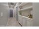 Hallway with built-in shelving units for storage and decorative display at 10402 E Javelina Ave, Mesa, AZ 85209