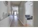 Inviting hallway with tiled floors, leading to an open living area and another room at 10402 E Javelina Ave, Mesa, AZ 85209