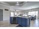 Kitchen featuring a large island with seating and great flow to the dining and living areas at 10402 E Javelina Ave, Mesa, AZ 85209