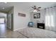 Bright living room with tile floors, a ceiling fan, a patterned rug, and neutral walls at 10402 E Javelina Ave, Mesa, AZ 85209