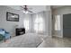 Comfortable living room features tile floors, decorative rug, neutral walls and a ceiling fan at 10402 E Javelina Ave, Mesa, AZ 85209