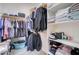 Bright walk-in closet with custom shelving and hanging rods for optimal storage and organization at 10402 E Javelina Ave, Mesa, AZ 85209