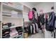 A well-organized walk-in closet with shelving, hanging rods, providing ample storage space for clothes and accessories at 10402 E Javelina Ave, Mesa, AZ 85209