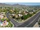 Aerial view of the neighborhood, showcases attractive homes and lush vegetation near the mountains at 10424 N 7Th Pl # 2, Phoenix, AZ 85020