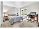 Bright bedroom with carpet, a large window, desk and chair at 10424 N 7Th Pl # 2, Phoenix, AZ 85020