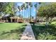 Community pool area with ramada and palm trees at 10424 N 7Th Pl # 2, Phoenix, AZ 85020