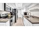 Efficient kitchen offers white cabinets and modern appliances at 10424 N 7Th Pl # 2, Phoenix, AZ 85020