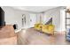 Bright living room features fireplace and stairs to upstairs at 10424 N 7Th Pl # 2, Phoenix, AZ 85020