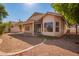 Backyard featuring a covered patio, desert landscaping and privacy fence at 10923 W Ivory Ln, Avondale, AZ 85392