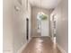 Inviting entryway showcases tile flooring, high ceilings, and a charming chandelier at 10923 W Ivory Ln, Avondale, AZ 85392