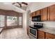 Eat-in kitchen features stainless steel appliances and granite countertops at 10923 W Ivory Ln, Avondale, AZ 85392