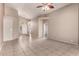 Spacious living room featuring tile floors, neutral walls, and archways at 10923 W Ivory Ln, Avondale, AZ 85392