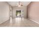 Bright living room features tile flooring, high ceilings and a sliding glass door at 10923 W Ivory Ln, Avondale, AZ 85392