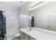 Neutral bathroom with a tub, shower, and vanity with ample counter space at 13796 W Mauna Loa Ln, Surprise, AZ 85379