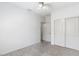 Carpeted bedroom with window and closet space at 13796 W Mauna Loa Ln, Surprise, AZ 85379