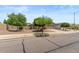 Well-maintained home with mature trees, desert landscaping, and a two-car garage at 13796 W Mauna Loa Ln, Surprise, AZ 85379