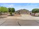Attractive single-Gathering home with a well-maintained lawn and mature landscaping at 13796 W Mauna Loa Ln, Surprise, AZ 85379