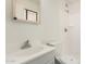 Bathroom featuring a vanity sink, toilet, and tiled shower at 1512 W Crescent Ave, Mesa, AZ 85202