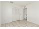 A bedroom featuring tile floors and closet at 1512 W Crescent Ave, Mesa, AZ 85202