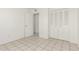 Neutral bedroom featuring tile floors and closet space at 1512 W Crescent Ave, Mesa, AZ 85202