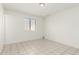 Bright bedroom featuring tile floors and a window for natural light at 1512 W Crescent Ave, Mesa, AZ 85202