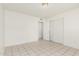 Neutral bedroom featuring tile floors and closet space at 1512 W Crescent Ave, Mesa, AZ 85202