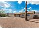 Quaint single-story home with a low-maintenance gravel front yard and a mature palm tree at 1512 W Crescent Ave, Mesa, AZ 85202