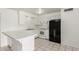 View of the kitchen with white cabinets, appliances, countertop, and tile floors at 1512 W Crescent Ave, Mesa, AZ 85202