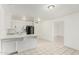 Bright kitchen features a breakfast bar, white cabinets, and black refrigerator at 1512 W Crescent Ave, Mesa, AZ 85202