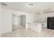 Bright kitchen with white cabinetry, tile floors, and an adjacent dining area with sliding glass doors at 1512 W Crescent Ave, Mesa, AZ 85202