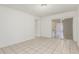 An open living room with tile floors and access to the kitchen and balcony at 1512 W Crescent Ave, Mesa, AZ 85202