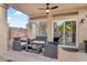 Outdoor seating area with desert landscaping and ceiling fan at 1574 E Scott Ave, Gilbert, AZ 85234