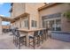 Outdoor bar with eight seats overlooking patio and desert landscaping at 1574 E Scott Ave, Gilbert, AZ 85234
