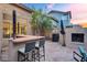Outdoor bar area featuring chairs and outdoor fireplace at 1574 E Scott Ave, Gilbert, AZ 85234