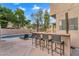 Outdoor bar area with chairs, pool with desert landscaping at 1574 E Scott Ave, Gilbert, AZ 85234