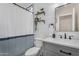 Bright bathroom offers shiplap accent, floating shelves, and updated fixtures at 1574 E Scott Ave, Gilbert, AZ 85234